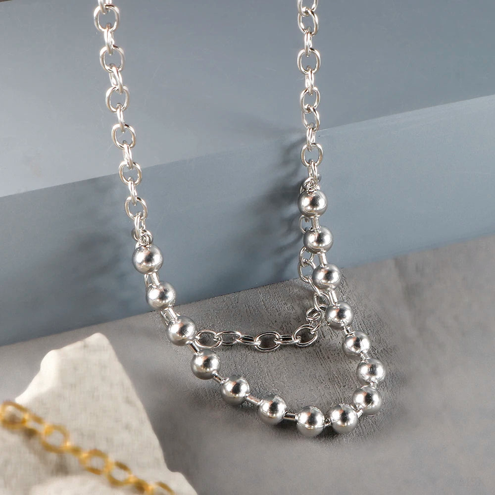 Stainless steel creative ball chain necklace for women, minimalist jewelry design with small round beads on a sleek chain.