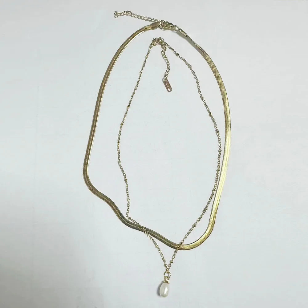 Stainless steel creative ball chain necklace featuring minimalist design, worn by a woman in stylish jewelry fashion.