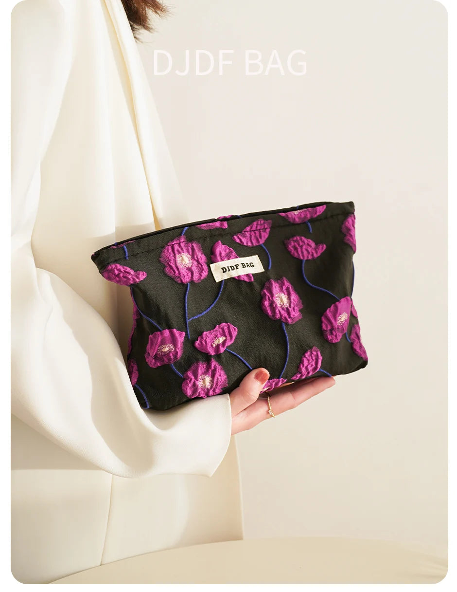 Purple Charm women's makeup bag by Hotfashionitems, stylish cosmetic organizer pouch with zipper closure and compact design.