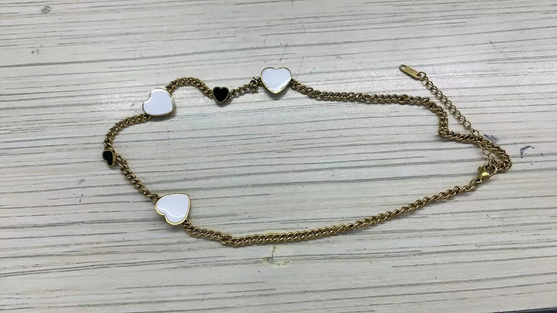 Stainless steel creative ball chain necklace for women, minimalist jewelry design, shiny metal finish, close-up view