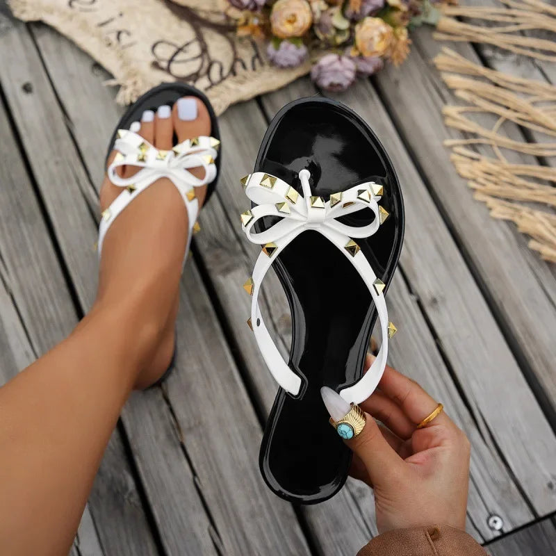 New Women's Flat Bottom Sandals Summer Rivet Butterfly Knot Slippers Slip-On Shoes PVC Material Comfortable Beach Footwear