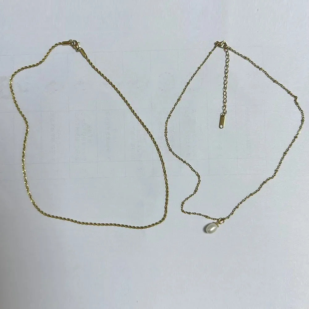 Stainless steel creative ball chain necklace for women, minimalist jewelry design with small spherical links.